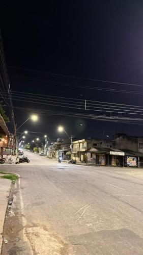 an empty street at night with street lights at Próximo a São Brás, Rodoviária e Supermercado! in Belém