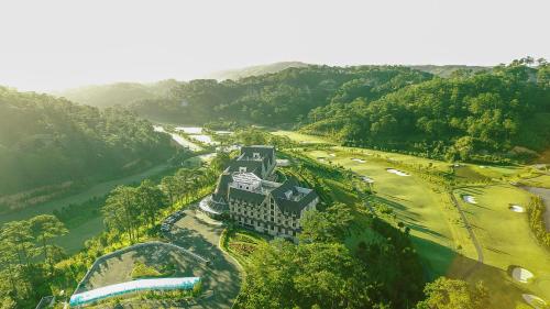 an aerial view of a resort with a golf course at Swiss-Belresort Tuyen Lam in Da Lat