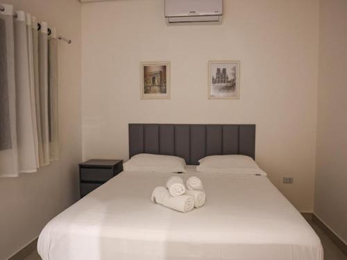 En eller flere senge i et værelse på Home Aguas da barra Ilhabela