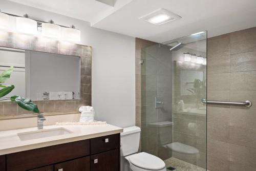 a bathroom with a shower and a toilet and a sink at Lahaina Shores 418 in Lahaina