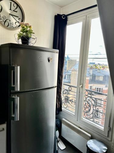 Studio Haut Haut de Gamme - Bain de lumière - Vue sur Paris