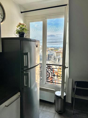 Studio Haut Haut de Gamme - Bain de lumière - Vue sur Paris