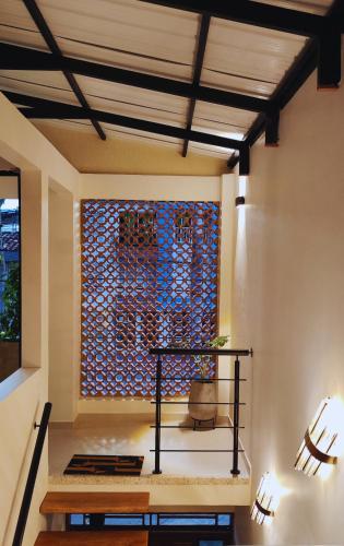 a living room with a wall with a window at Spacious apartment in Buga, super central in Buga