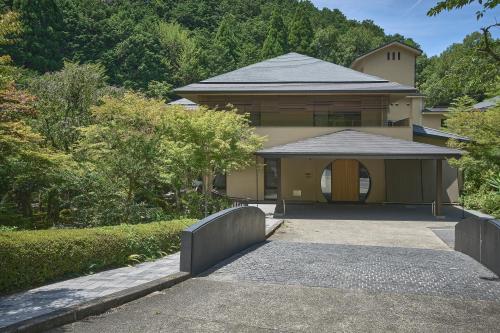 a house with a fence in front of it at moksa in Kyoto