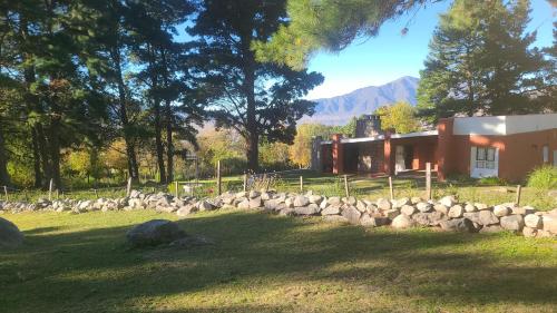 a pile of rocks in front of a building at La Quebradita-Tafi del Valle in Tafí del Valle