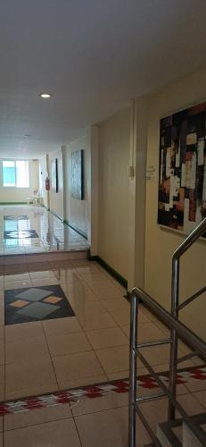 a lobby with a staircase in a building at AT home hotel in Hua Hin