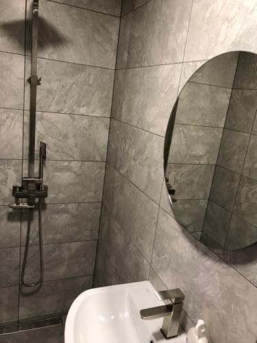 a bathroom with a sink and a mirror at Берег Світязя 3 in Svityazʼ