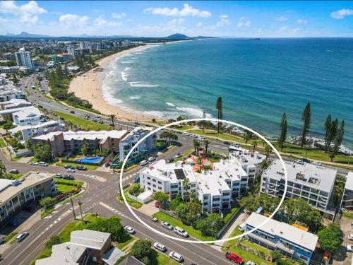 an aerial view of a city and the beach at Alex Headland Beachfront in Alexandra Headland