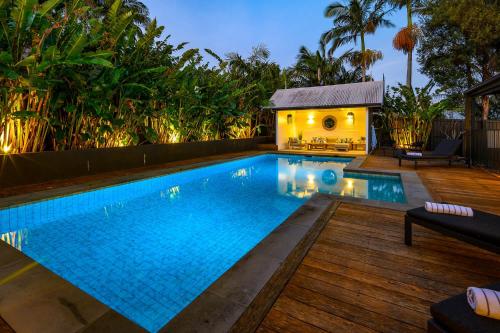 a swimming pool in a backyard with a house at Luxury Family Estate l Pool & Pet Friendly l Nova Escapes in Bangalow