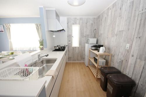 a kitchen with a sink and a counter top at THE FEEL ONNA 2 / Vacation STAY 18771 in Onna