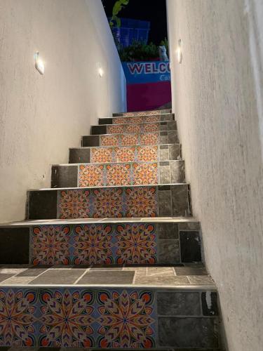 a set of stairs with colorful tiles on them at Casa Santorini in Cartagena de Indias