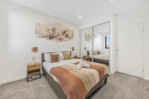Ένα ή περισσότερα κρεβάτια σε δωμάτιο στο Liverpool 2 bedroom apartment with convenient transportation and surrounded by food
