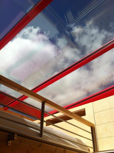 a view of the sky through the window of a bed at Pavillon "CASSIOPÉE" in Rosnay