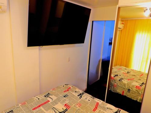 En eller flere senge i et værelse på Apê Surpreendente no Coração da Cidade