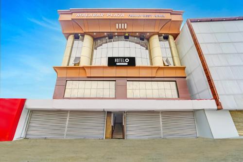 a building with a sign on the front of it at Hotel O Padma Junction MG Road in Cochin