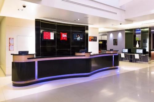 a large lobby with a counter in a store at Ibis Bangkok Sukhumvit 4 in Bangkok