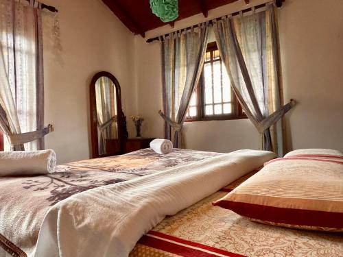Ένα ή περισσότερα κρεβάτια σε δωμάτιο στο Cozy Heaven