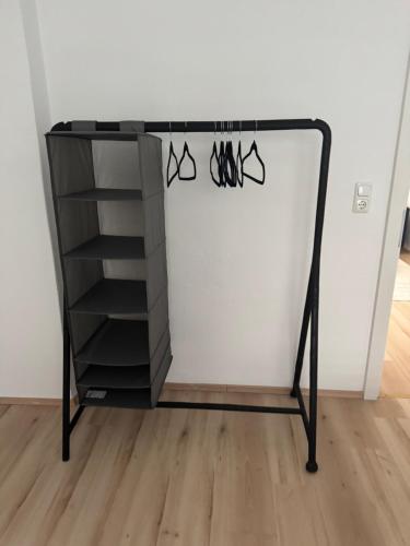 a black dresser with shoes hanging on a wall at Apartment Nice in Gmunden in Gmunden