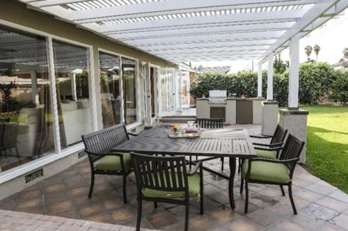 a patio with a table and chairs on a patio at Destination #36 in Anaheim
