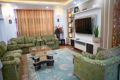 Predel za sedenje v nastanitvi Friendly Homes DR