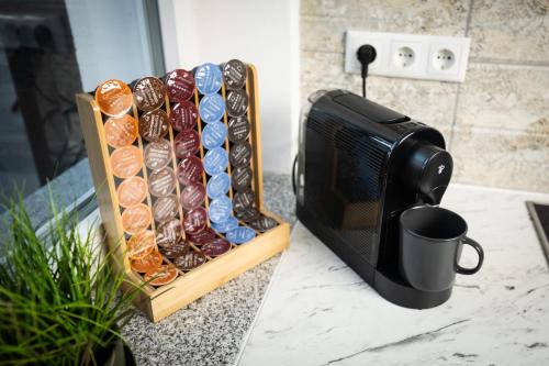 a table with a coffee cup and a box of donuts at Landhaus Oase im Herzen Oberviechtachs in Oberviechtach