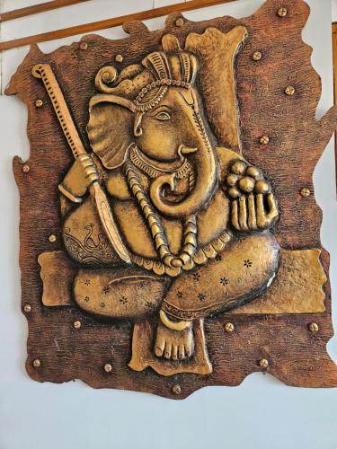 a painting of an elephant holding a baseball bat at Abhilasha 1 in Pachmarhī