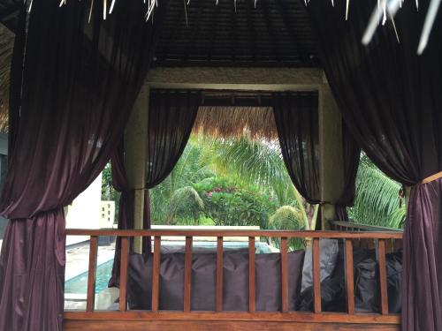 Ein Balkon oder eine Terrasse in der Unterkunft Nipah Villas