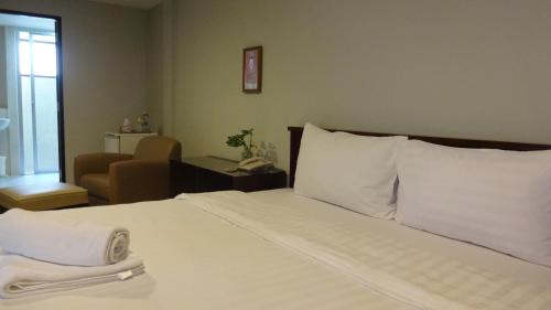 Ένα ή περισσότερα κρεβάτια σε δωμάτιο στο Mango Bedroom Inn