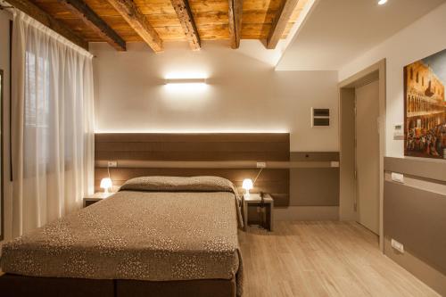 Letto o letti in una camera di Foresteria Levi