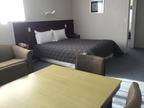 Ένα ή περισσότερα κρεβάτια σε δωμάτιο στο Thornton Lodge Motel