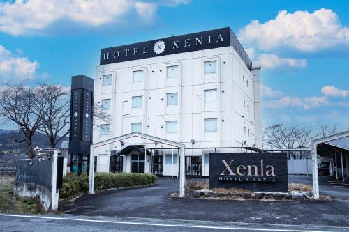a hotel kenka building with a sign on it at Hotel Xenia Mikumo (Adult Only) in Konan