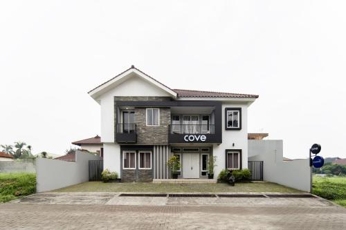a rendering of a white house at Cove Stariez in Binong