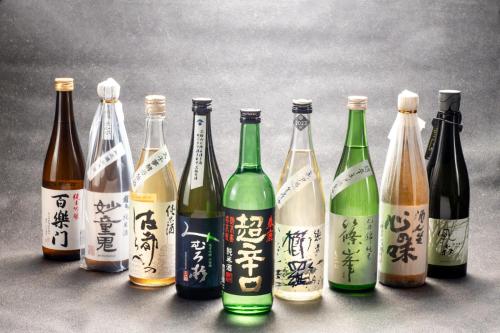 a group of bottles of wine with writing on them at Temple Town Hotel WAQOO Horyuji in Ikaruga