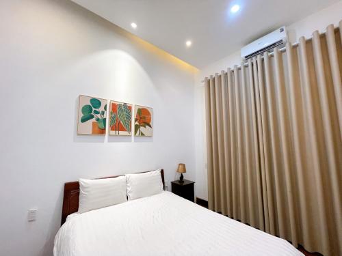 Ένα ή περισσότερα κρεβάτια σε δωμάτιο στο Ngoc Toan Retreat