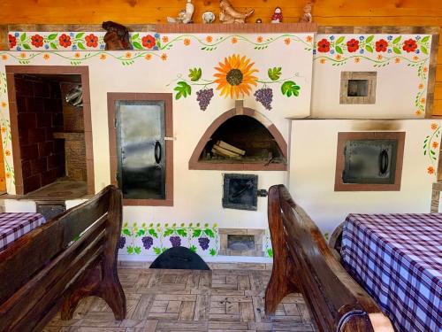 a room with two beds and a wall with a fireplace at Котедж Синевир in Synevyr