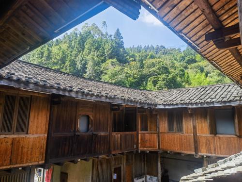 a view from the inside of a building with a roof at Tsingpu Tulou Retreat 青普文化行馆 南靖土楼店 in Nanjing