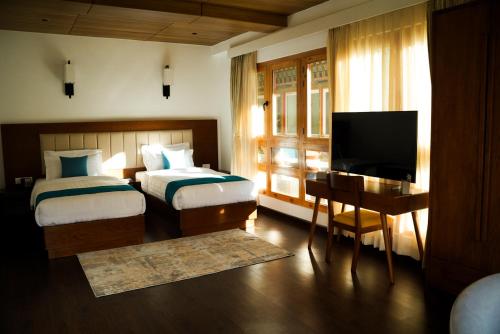 En eller flere senge i et værelse på The 33rd Executive Suites