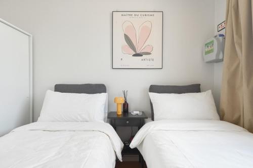 Ένα ή περισσότερα κρεβάτια σε δωμάτιο στο Panoramic View Seoul Station 2BR Newly Built