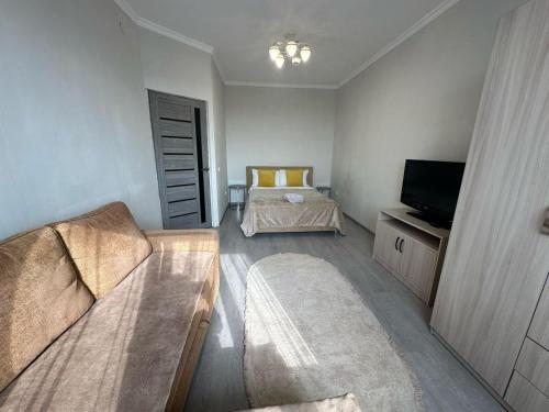 Katil atau katil-katil dalam bilik di Apartment оn Makatayeva 5 b