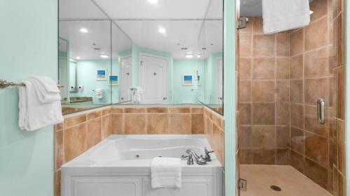 a bathroom with a large tub and a shower at North Beach Resort and Villas #1916 - Oceanfront in Myrtle Beach
