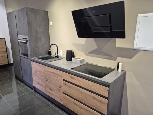 Kuchyň nebo kuchyňský kout v ubytování Schwarzwald City Loft 2