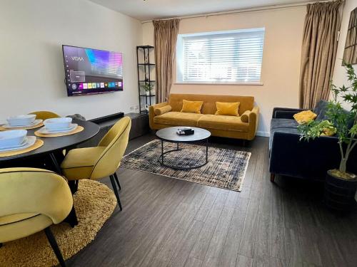 a living room with a couch and a table at Luxury 2 bed house in Dartford, United Kingdom in Dartford