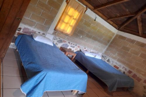 Postel nebo postele na pokoji v ubytování OYO Hotel Rincon De Texolo