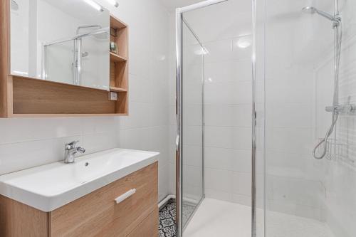 a bathroom with a sink and a shower at Bright Studio 3P – Close to Deauville Beach in Deauville