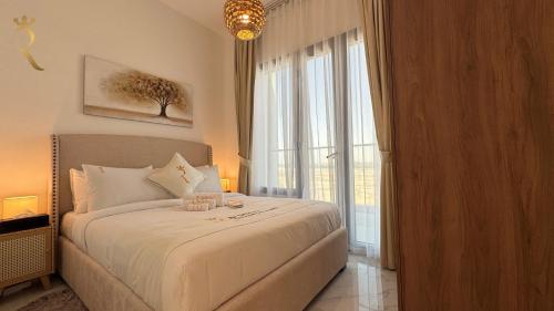 a bedroom with a large bed and a large window at Elegant 2BR - Rooftop Luxe Skyline Escape in Abu Dhabi