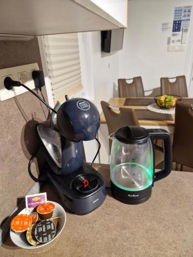 a blender sitting on a counter with a bowl of food at Luxury Floating Sea House Star Line - Marina Portorož in Portorož