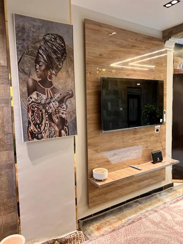 a painting of a woman on a wall in a room at Super Elite apartments & Studios - Aswan city center apartments in Aswan
