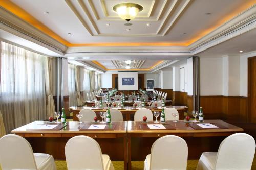 a large conference room with a large table and chairs at Melia Purosani Yogyakarta in Yogyakarta