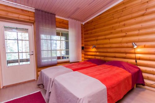 Ένα ή περισσότερα κρεβάτια σε δωμάτιο στο Koli Iso-Ryläys