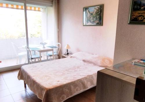 Ένα ή περισσότερα κρεβάτια σε δωμάτιο στο Agréable Studio